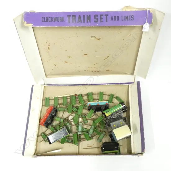 CHAD VALLEYS CLOCKWORK TRAIN SET & TRACKS. IN ORIGINAL BOX WHICH HAS WEAR.